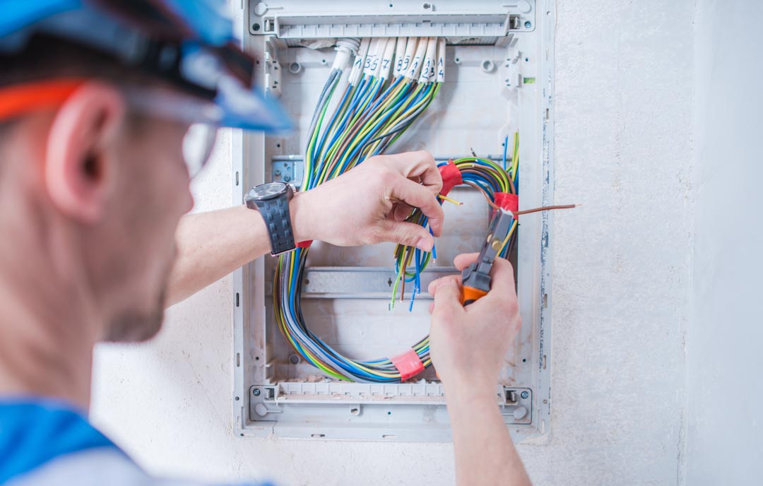 Electric Technician Installing Electrical System