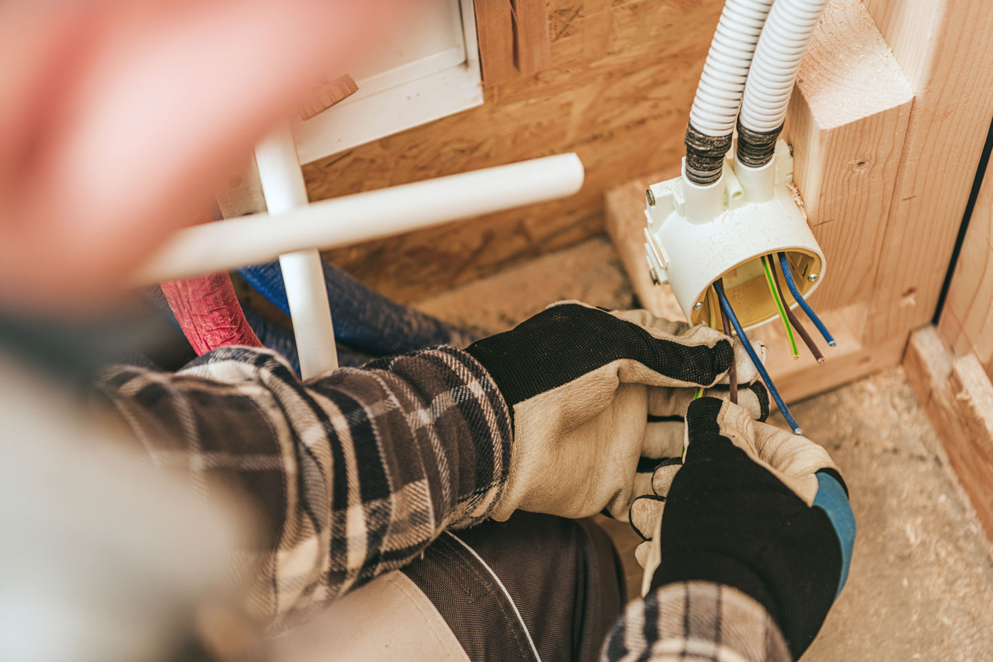 Electrician installing power outlet